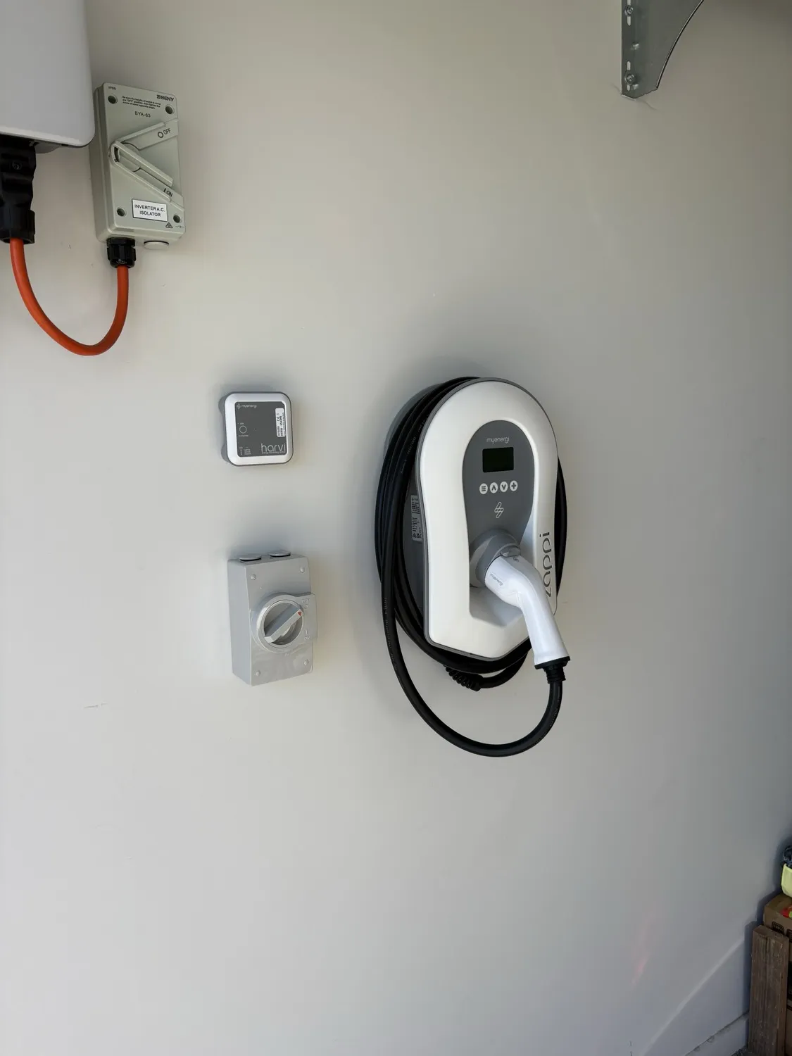 Zappi EV charger installed with a dedicated isolator and weatherproof switch