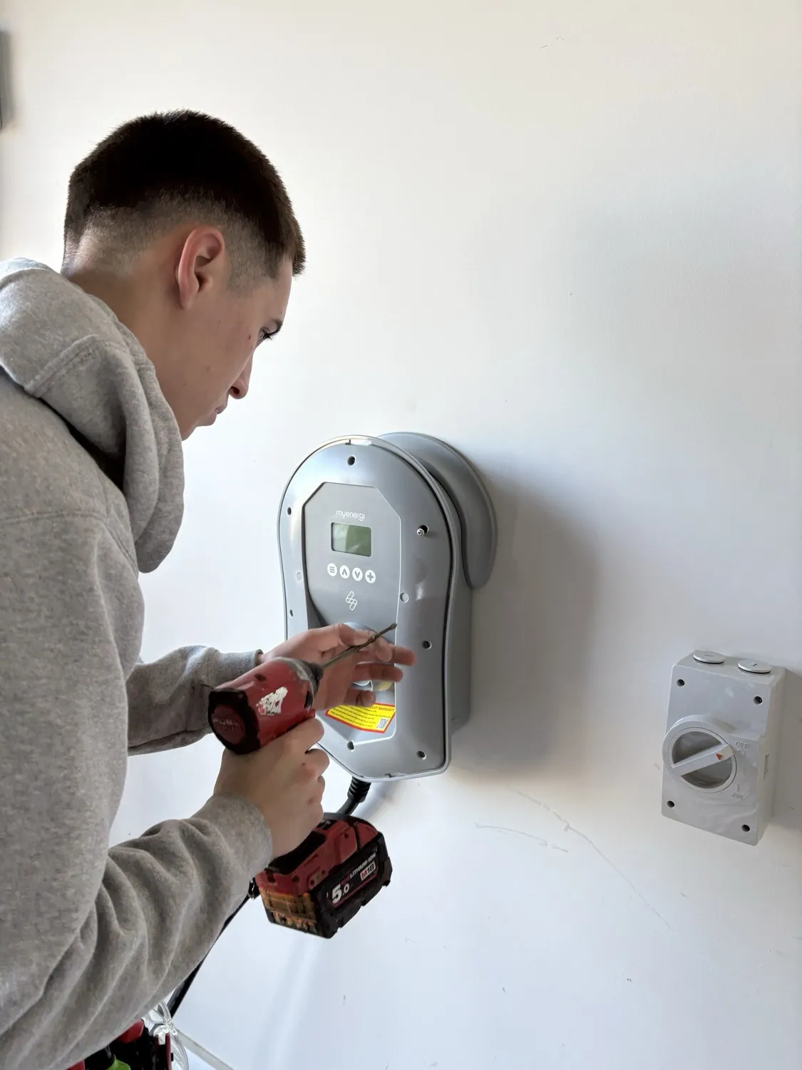 Power Amp Electrical electrician installing a myenergi Zappi EV charger in Melbourne